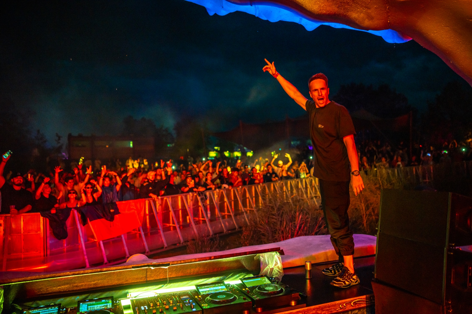 Dannic standing on the DJ booth at Tomorrowland 2025